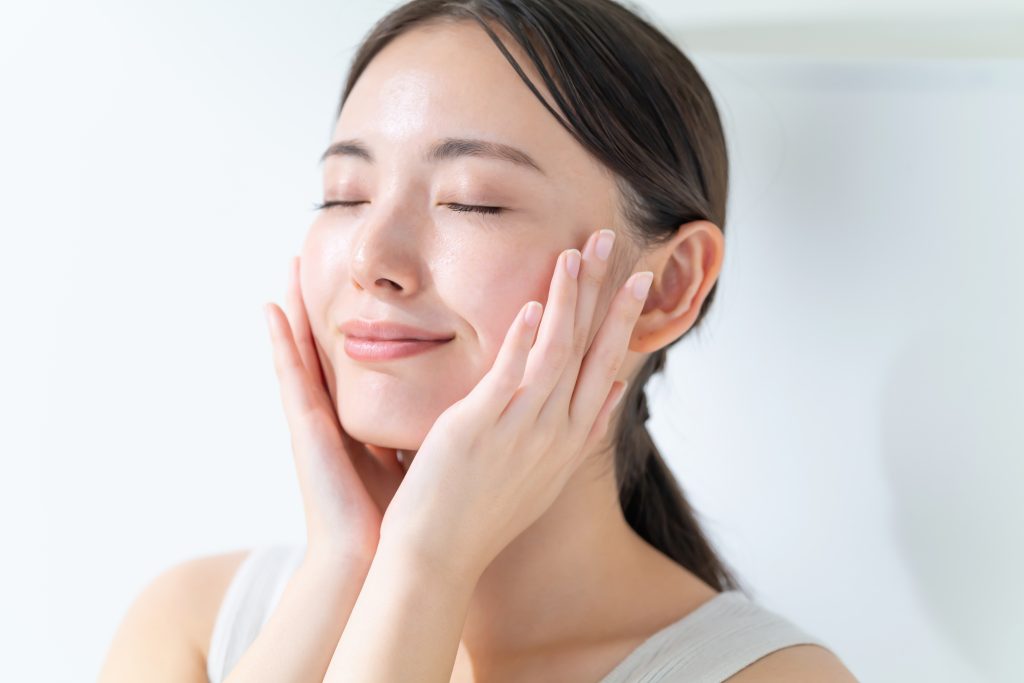 Woman with clear, hydrated skin representing results from injectable skin boosters such as REJURAN® and Profhilo.